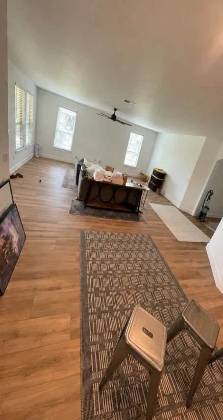 Remodeled Austin living room with new wood-look flooring